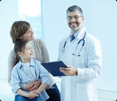 Hospital receptionist using OPDX clinic management system on desktop